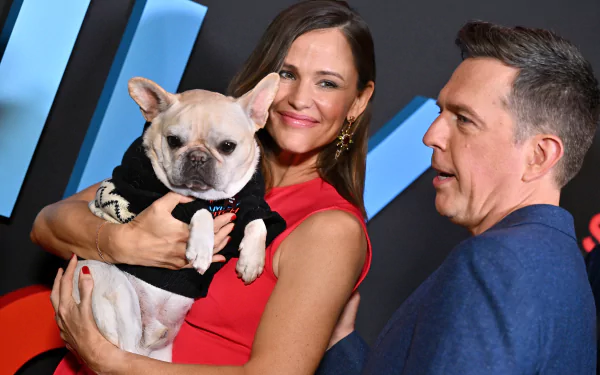 HD wallpaper featuring characters from the movie Family Switch, starring Jennifer Garner and Ed Helms, capturing the fun and chaos of family life.