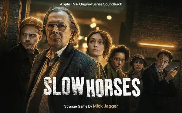 HD wallpaper from the TV show *Slow Horses*, featuring a group of characters in a gritty urban setting, with the series title prominently displayed.