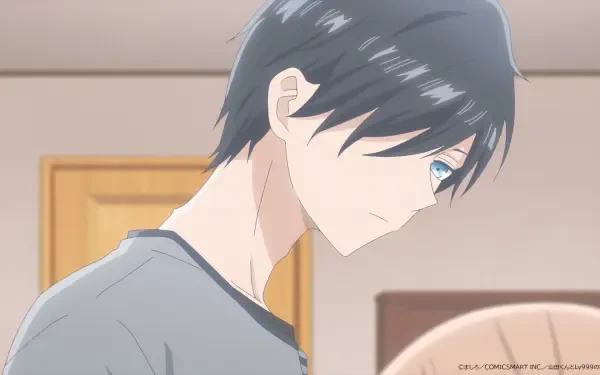 A close-up of a character from My Love Story With Yamada-kun at Lv999, featuring a young man with dark hair and striking blue eyes, set against a soft interior background.