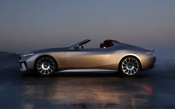 Side view of a sleek BMW Skytop convertible, highlighted by its modern design and stylish wheels, set against a serene backdrop. A stunning 4K Ultra HD desktop wallpaper.