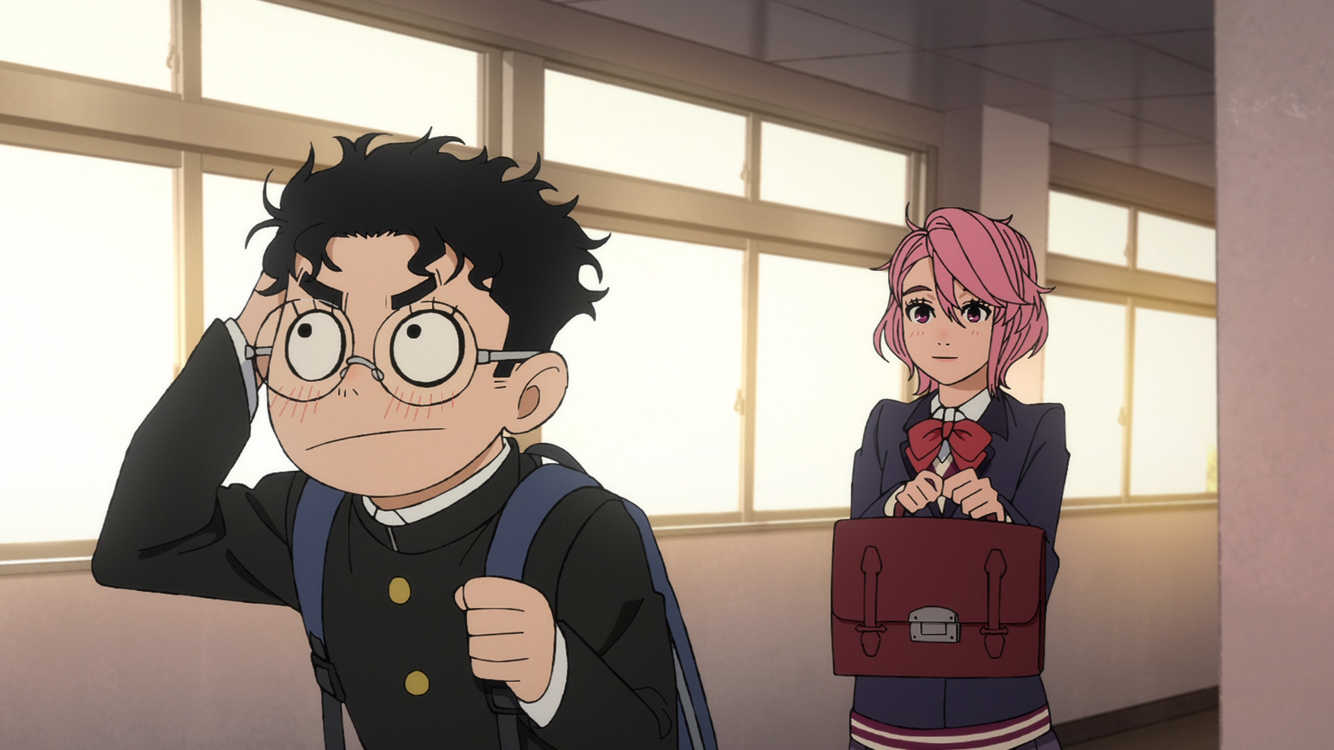 HD PC desktop wallpaper of Dandadan: Ken Takakura adjusting his glasses with a backpack, and Aira Shiratori holding her satchel, standing in a sunlit school hallway.