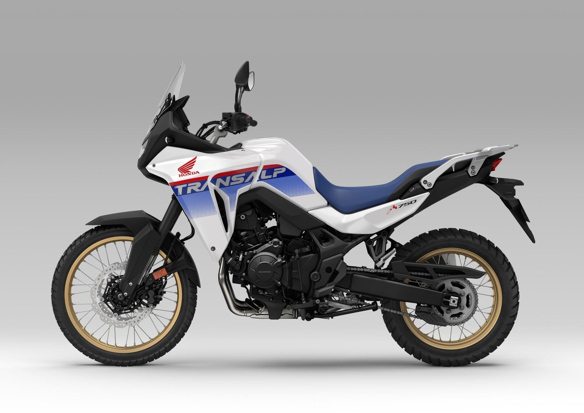 A sleek Honda XL750 Transalp motorcycle stands against a neutral background, showcasing its adventure-ready design in this vibrant 4K Ultra HD wallpaper.