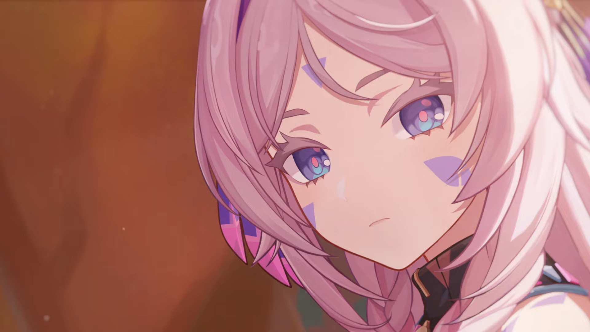 HD PC desktop wallpaper of Citlali from the Genshin Impact video game: close-up portrait of a pink-haired girl with purple-blue eyes and triangular face markings, soft warm background.