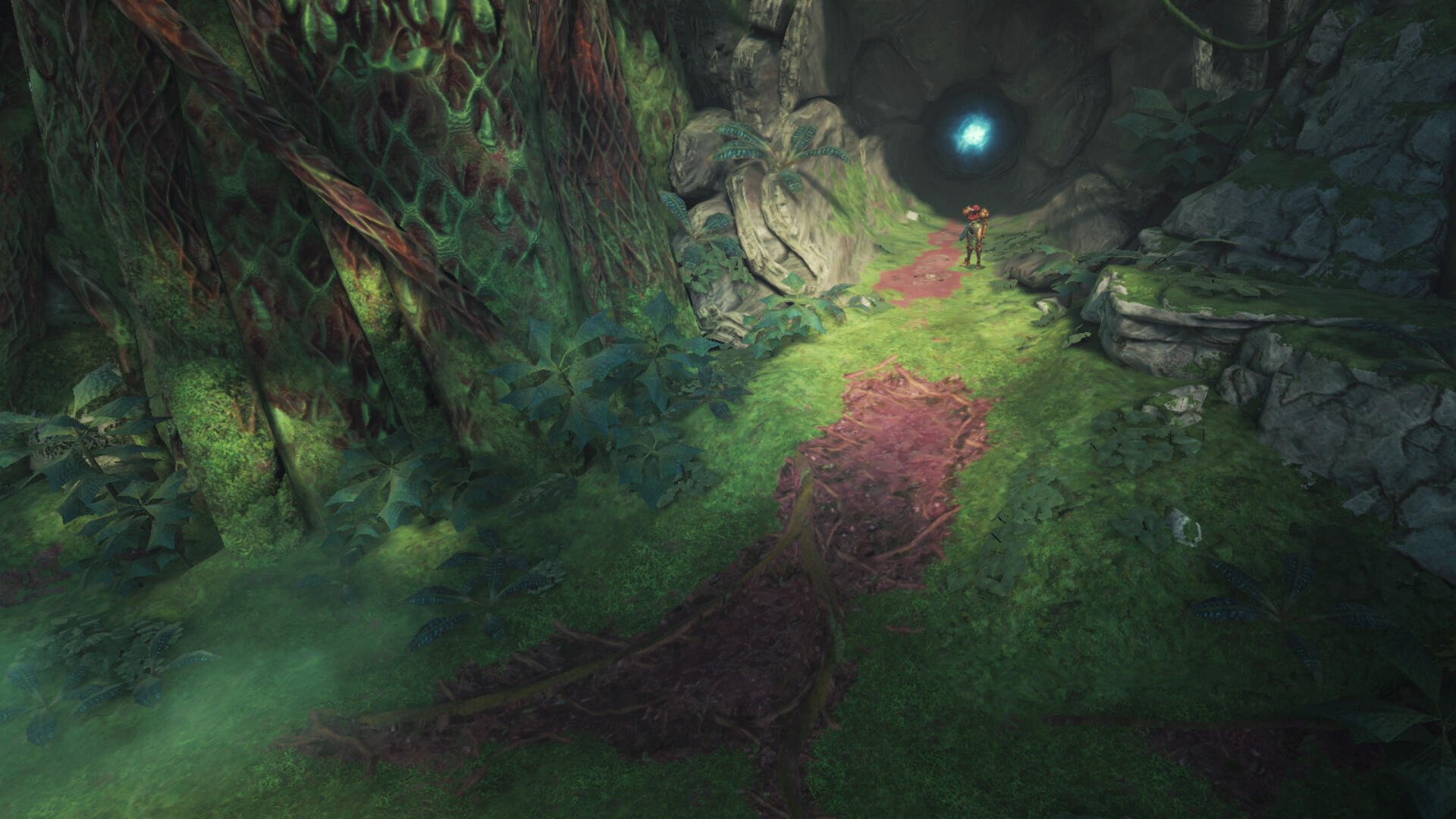 A lush, vibrant landscape from Metroid Prime 4: Beyond, featuring a winding path through dense foliage leading to a mysterious blue light in a dark tunnel. HD PC desktop wallpaper.