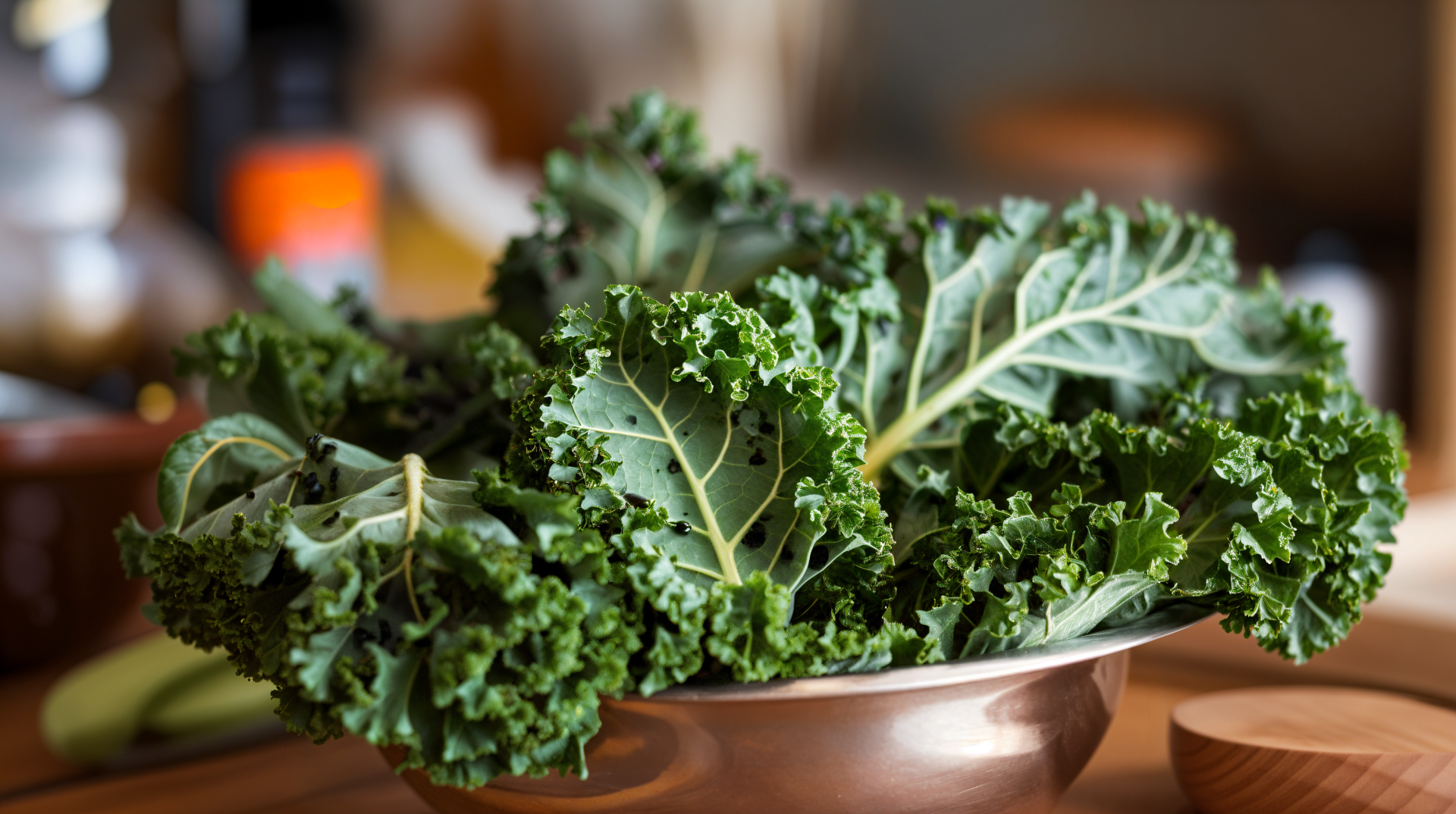 A bowl of fresh kale sits on a wooden surface, showcasing its vibrant green leaves, captured in stunning 4K Ultra HD for a striking desktop wallpaper.