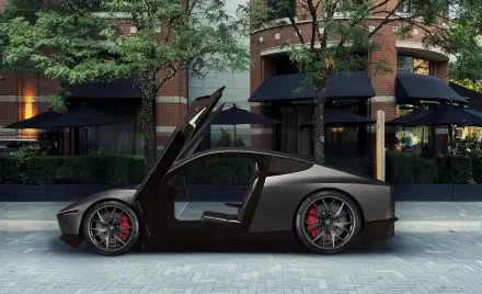 A sleek Tesla Cybercab robotaxi showcases its futuristic design with distinctive gullwing doors, parked in an upscale urban setting amid lush greenery.