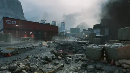 A high-definition PC desktop wallpaper depicting a desolate battlefield from Delta Force, featuring rocky terrain, scattered debris, and smoke rising in the background.