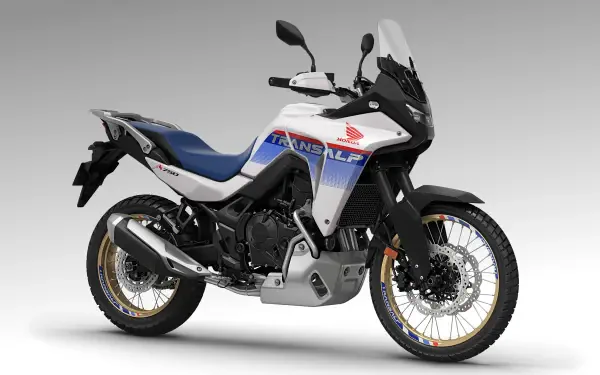 A Honda XL750 Transalp motorcycle in a sleek design, showcasing its adventurous spirit against a gray background, presented as a 4K Ultra HD desktop wallpaper.