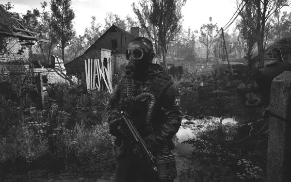 A character in a gas mask stands in a desolate landscape from S.T.A.L.K.E.R. 2: Heart of Chernobyl, showcasing the game's atmospheric and haunting environment in stunning detail.