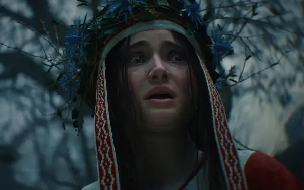 A haunting scene from The Witcher IV, featuring a character with a floral crown, conveying a sense of fear and intrigue, set against a shadowy forest backdrop. Ideal HD wallpaper for fans.