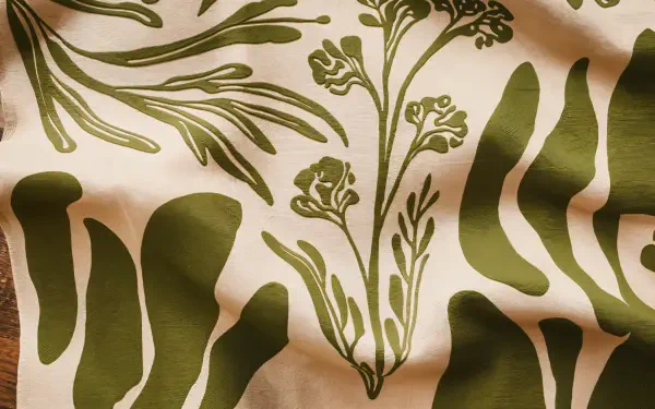A beautifully patterned fabric showcasing intricate green floral designs on a creamy background, perfect for a 4K Ultra HD desktop wallpaper and background.