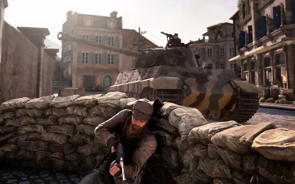 A soldier takes cover behind a barricade as a tank looms in the background, capturing a tense moment from Sniper Elite: Resistance in stunning 4K Ultra HD.