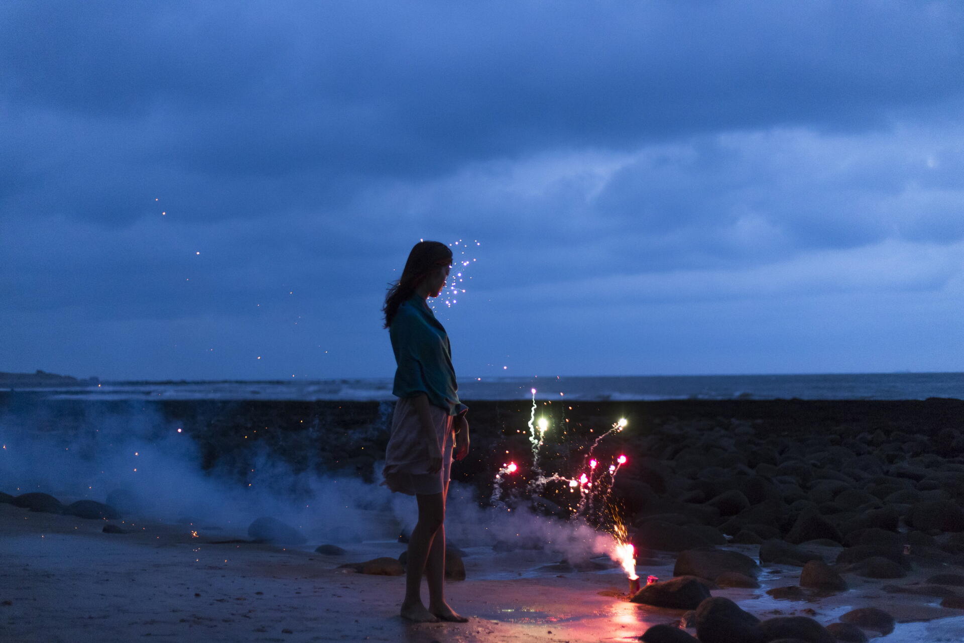 Download Woman Fireworks Night Beach 8k Ultra HD Wallpaper