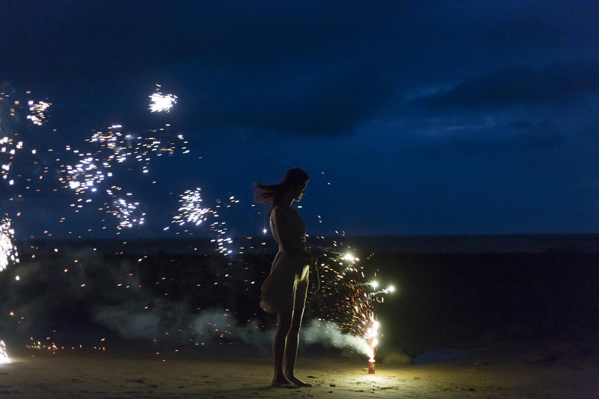 Download Woman Fireworks Night Beach 8k Ultra HD Wallpaper