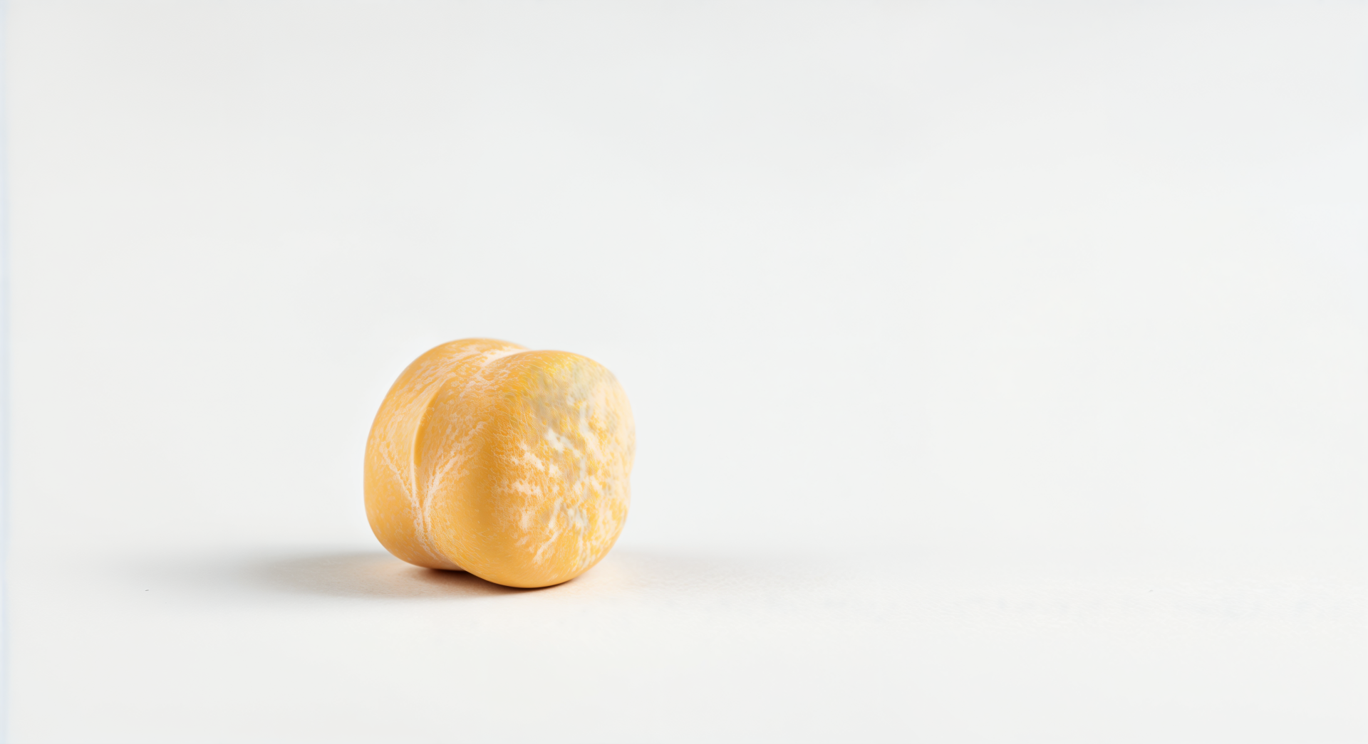 A close-up of a single chickpea on a white background, presented as a 4K Ultra HD PC desktop wallpaper and background.