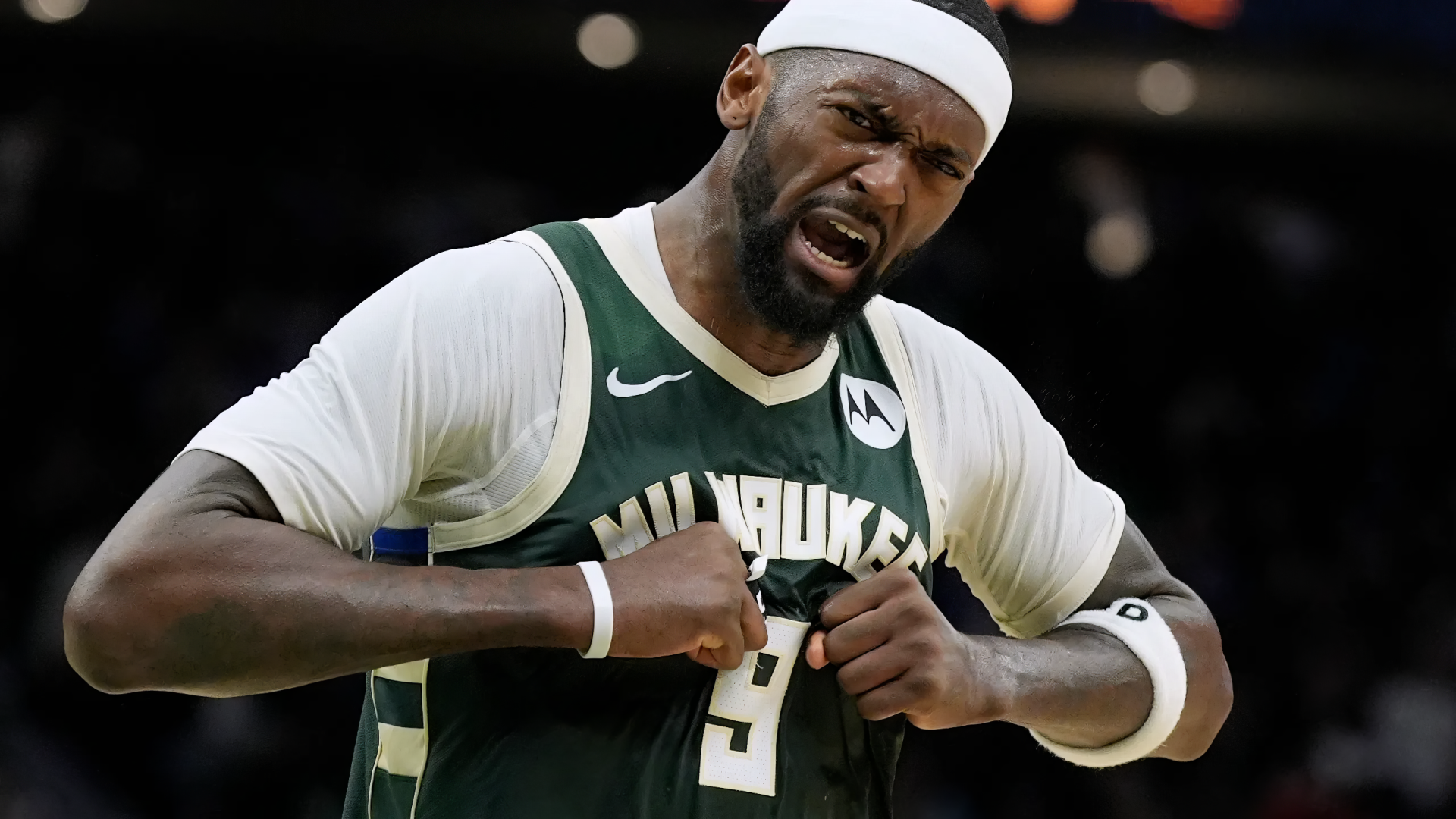 HD PC desktop wallpaper featuring Milwaukee Bucks player Bobby Portis Jr. in action wearing his team jersey during an NBA game.