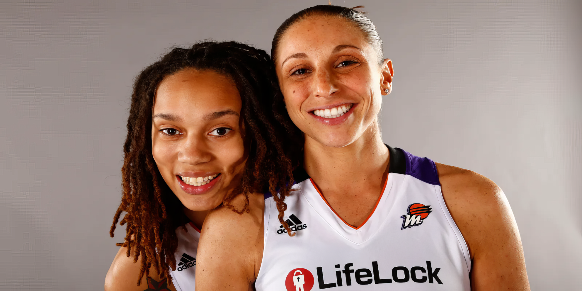 Diana Taurasi and Brittney Griner of the Phoenix Mercury pose together in their WNBA jerseys, showcasing their camaraderie and spirit in this vibrant HD desktop wallpaper.