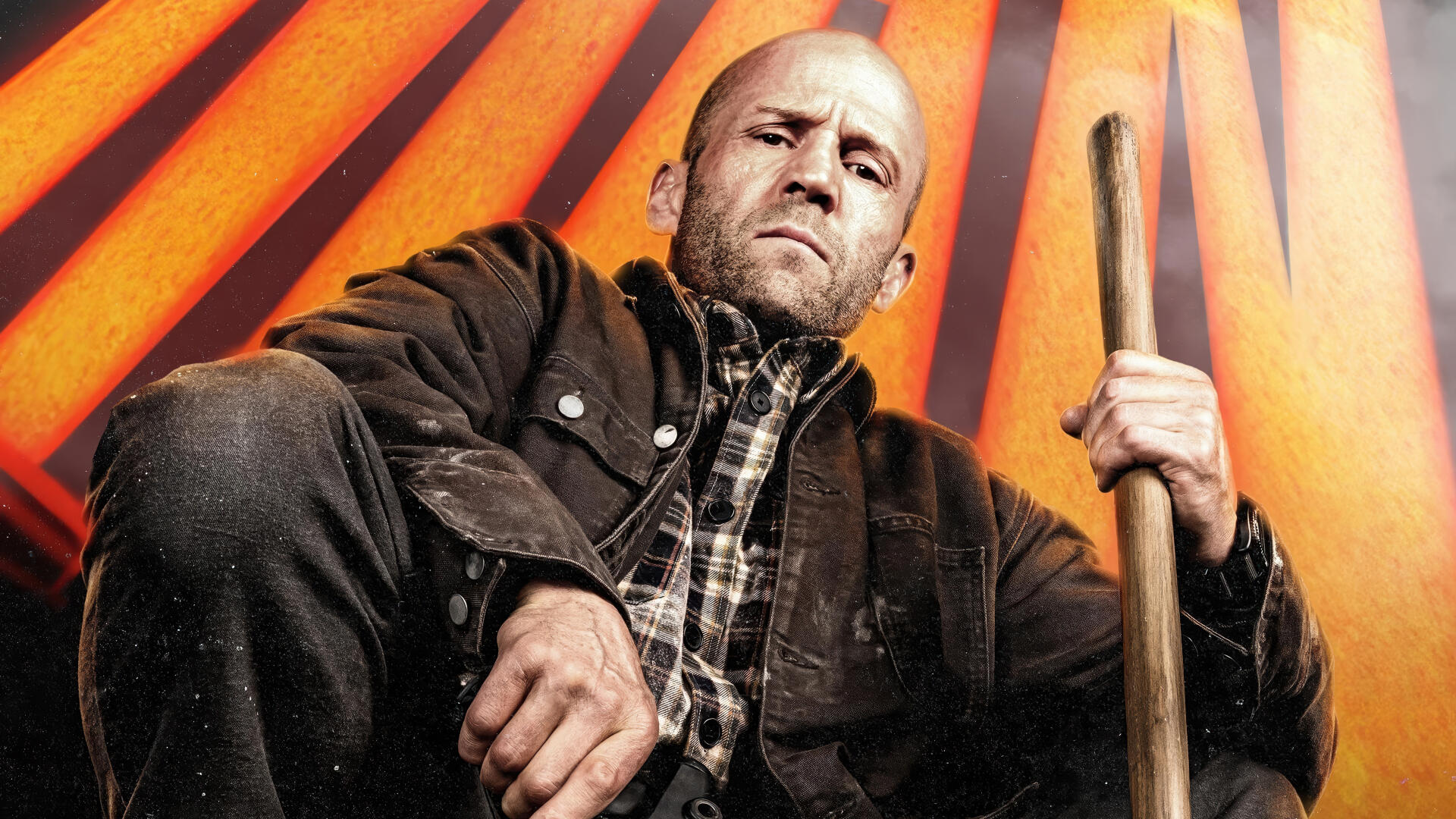 Jason Statham portrays a determined character in A Working Man, set against a striking backdrop with bold orange rays, captured in this vivid 4K Ultra HD wallpaper.