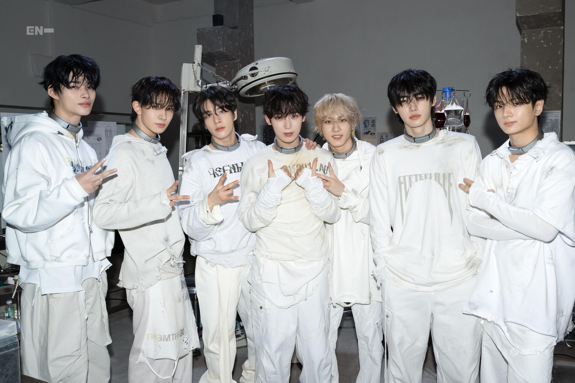 HD PC desktop wallpaper featuring the music group ENHYPEN posing together in coordinated white outfits against a neutral background.