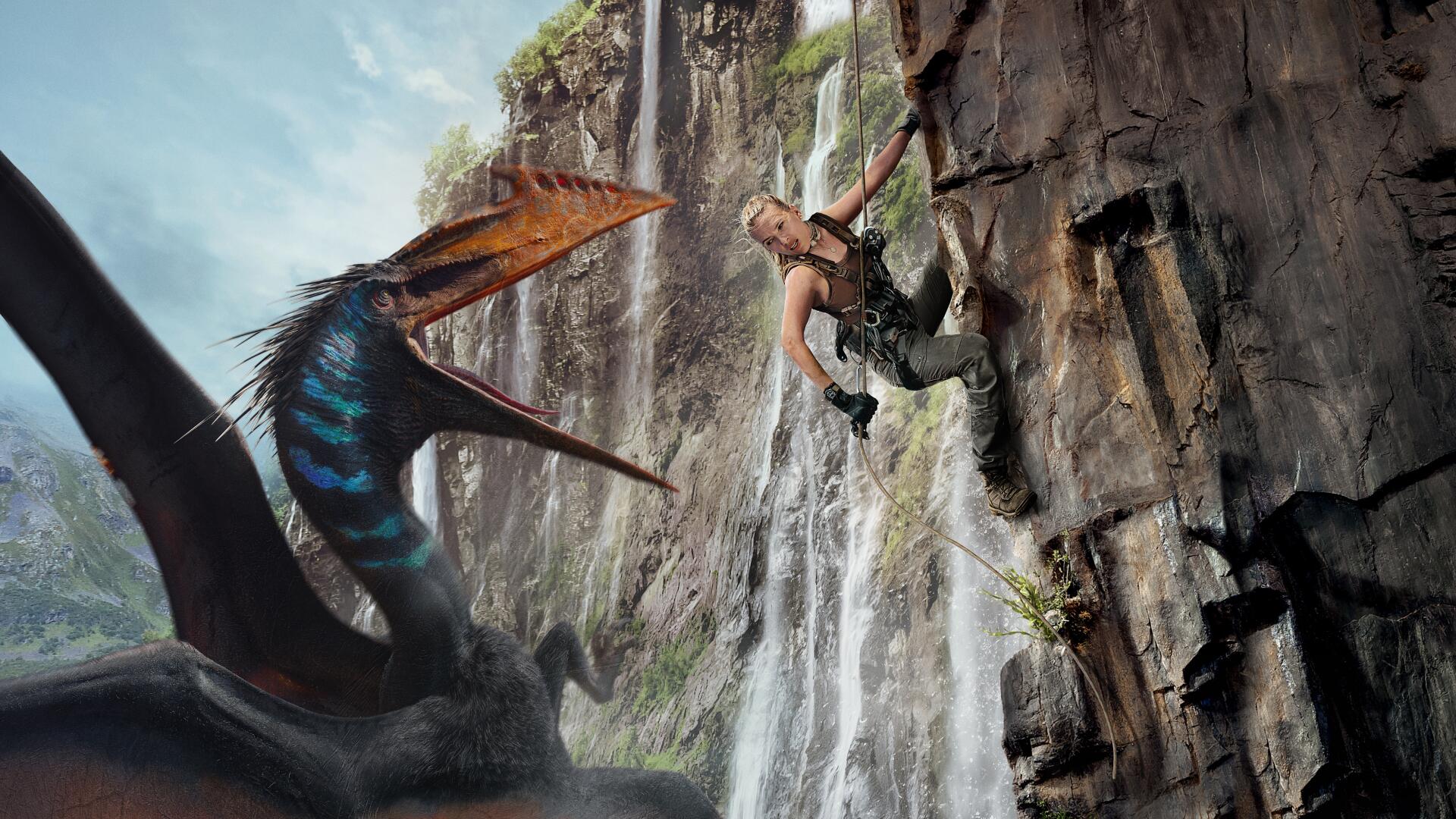 4K Ultra HD Jurassic World Rebirth wallpaper featuring a climber scaling a rocky cliff while a flying dinosaur with vibrant markings approaches below.