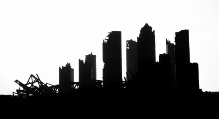 A haunting post-apocalyptic city silhouette, featuring crumbling skyscrapers against a stark white background. This 4K Ultra HD image serves as a striking desktop wallpaper.