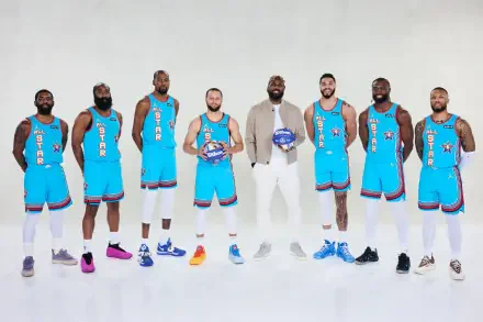 A group of NBA All-Star players, including Stephen Curry and LeBron James, poses in vibrant blue jerseys, showcasing their camaraderie and competitive spirit in a high-quality wallpaper image.