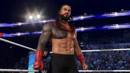 An HD PC desktop wallpaper featuring a wrestler in WWE 2K25, standing confidently in the ring, surrounded by an energetic crowd and vibrant arena lights.