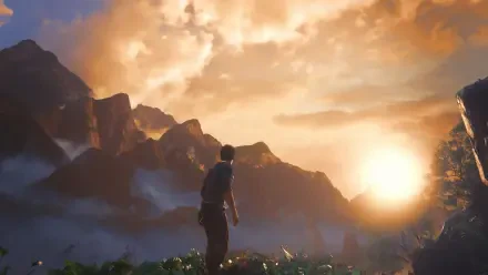 A stunning HD wallpaper from Uncharted 4: A Thief's End, featuring a silhouetted character gazing at a vibrant sunset over majestic mountains.