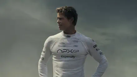 A cinematic 4K Ultra HD wallpaper featuring Brad Pitt in a sleek racing suit, reflecting the excitement of the upcoming F1 movie, set to release in 2025.