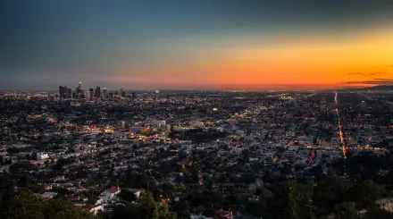 HD desktop wallpaper showcasing the Los Angeles cityscape at sunset, capturing the sprawling urban landscape and vibrant sky in the USA.