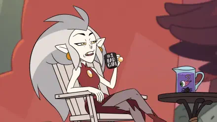 HD desktop wallpaper featuring Eda Clawthorne from the TV show The Owl House holding a #1 Bad Girl mug while sitting in a chair with a drink on a nearby table.