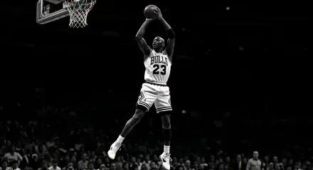Michael Jordan in mid-air wearing Chicago Bulls jersey, captured in dynamic action on a 4K Ultra HD PC desktop wallpaper and background.