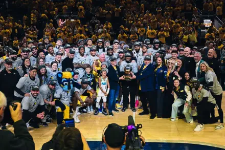 Indiana Pacers team and staff celebrate on the basketball court with fans in the background, captured in a vibrant 4K Ultra HD NBA sports desktop wallpaper.