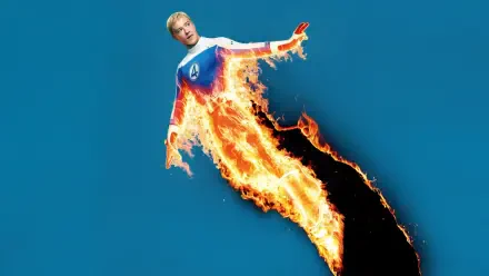 4K Ultra HD wallpaper of Joseph Quinn as Human Torch from The Fantastic Four: First Steps, showcasing fiery powers against a blue background.