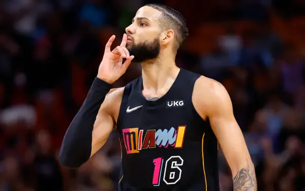 Caleb Martin of the Miami Heat gestures during an NBA game, showcasing his talent and passion for basketball in this dynamic HD wallpaper.