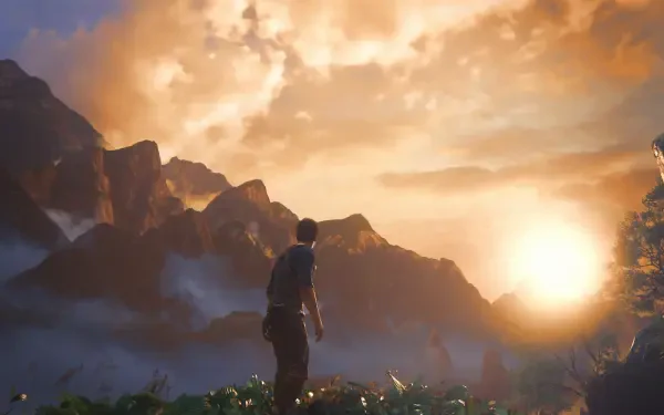 A stunning HD wallpaper from Uncharted 4: A Thief's End, featuring a silhouetted character gazing at a vibrant sunset over majestic mountains.