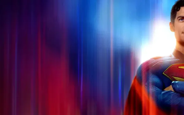 HD PC desktop wallpaper of Superman (2025): half-portrait showing the S emblem against vibrant red, blue and purple vertical light streaks.