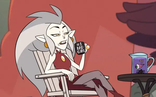 HD desktop wallpaper featuring Eda Clawthorne from the TV show The Owl House holding a #1 Bad Girl mug while sitting in a chair with a drink on a nearby table.