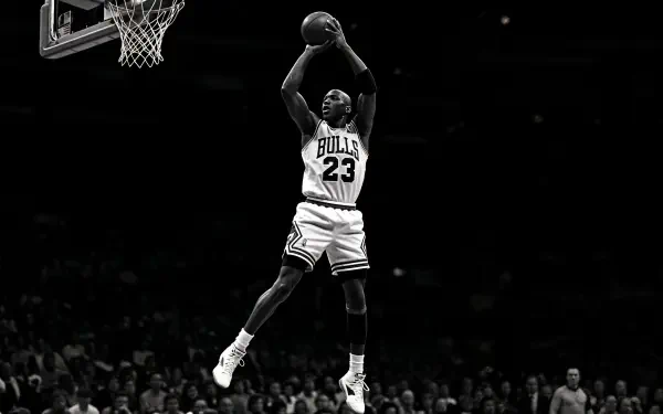 Michael Jordan in mid-air wearing Chicago Bulls jersey, captured in dynamic action on a 4K Ultra HD PC desktop wallpaper and background.