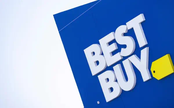 HD wallpaper featuring a close-up of the man-made Best Buy logo against a vibrant blue background.