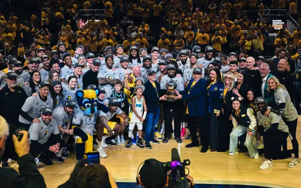 Indiana Pacers team and staff celebrate on the basketball court with fans in the background, captured in a vibrant 4K Ultra HD NBA sports desktop wallpaper.