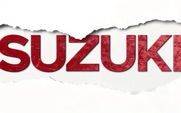 Suzuki logo with a torn paper effect in red and white, presented as a 4K Ultra HD PC desktop wallpaper and background.
