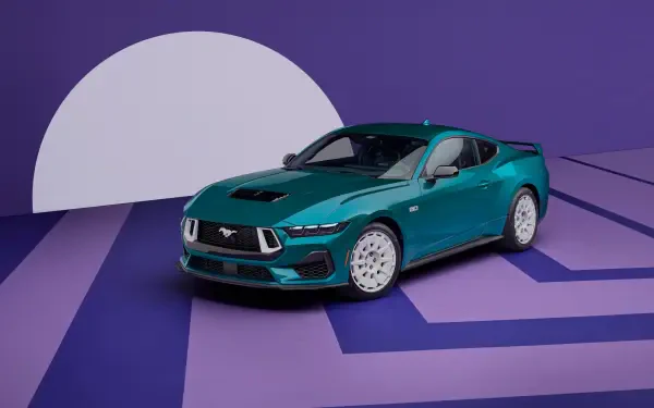 A teal Ford Mustang GT positioned on a stylized purple platform with a large white circle backdrop, shown in 4K Ultra HD as a PC desktop wallpaper.