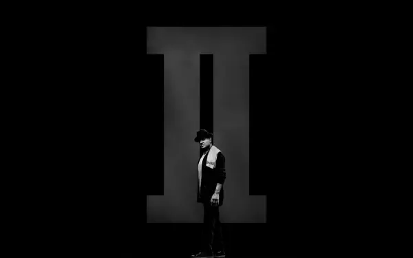 Creed II 4K Ultra HD PC desktop wallpaper: lone fighter in profile stands before a towering Roman numeral II against a stark black background.