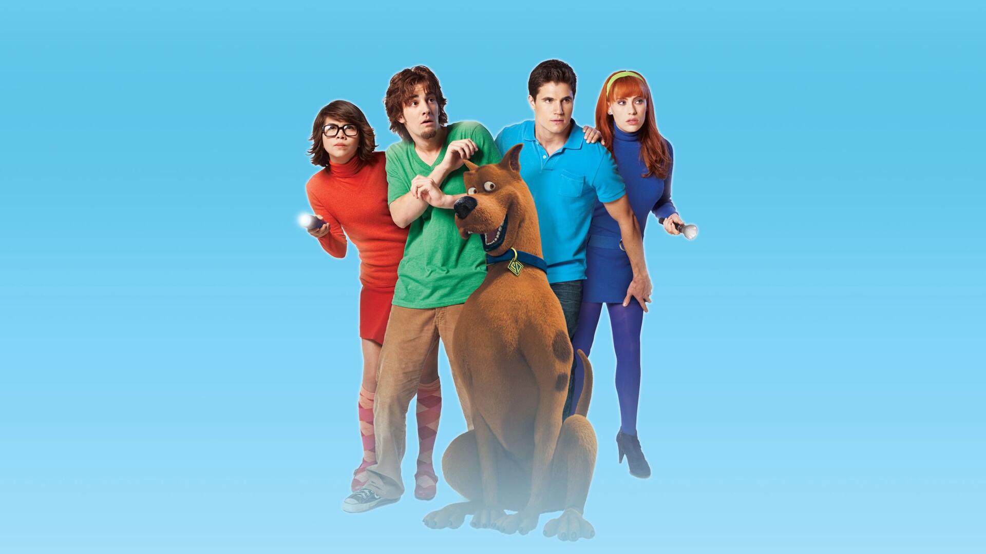 HD PC desktop wallpaper for Scooby-Doo! Curse of the Lake Monster showing Scooby-Doo with Fred, Daphne, Velma and Shaggy against a bright blue gradient background.