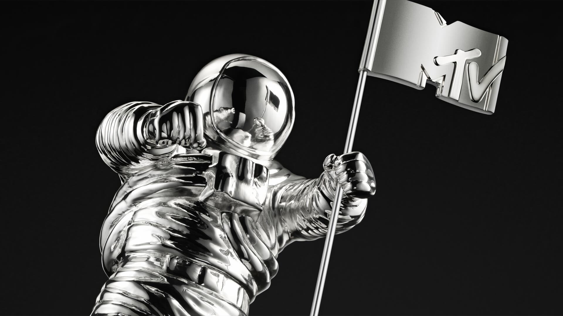 Shiny chrome MTV Moonman astronaut holding an MTV flag on a black background — HD PC desktop wallpaper/background themed around music and MTV.