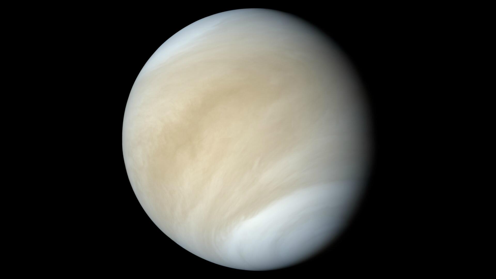 HD PC desktop wallpaper: close-up of a cloud-shrouded planet in space, pale cream swirls against a black background.