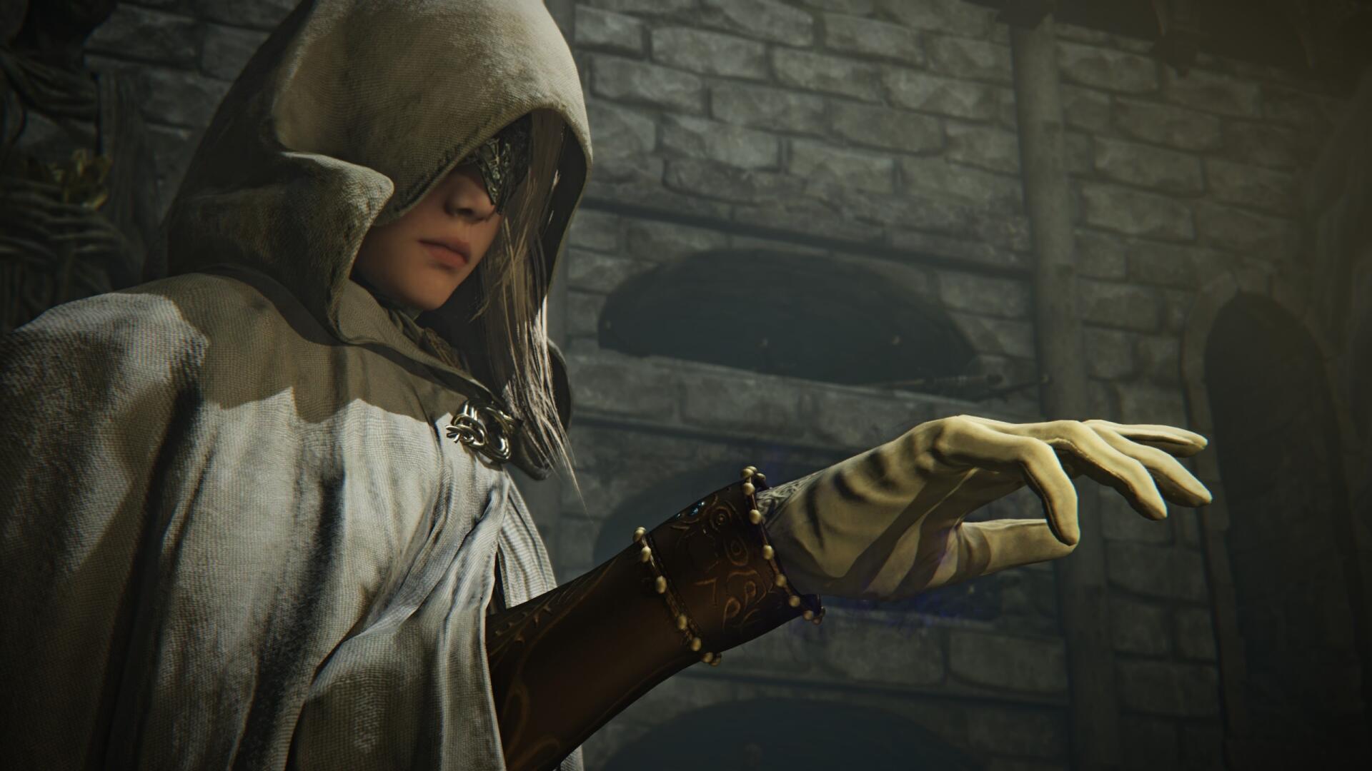 Video game Elden Ring Nightreign (Elden Ring) 2K Quad HD PC desktop wallpaper: hooded, gloved figure reaching forward in a dim stone chamber, moody fantasy atmosphere.