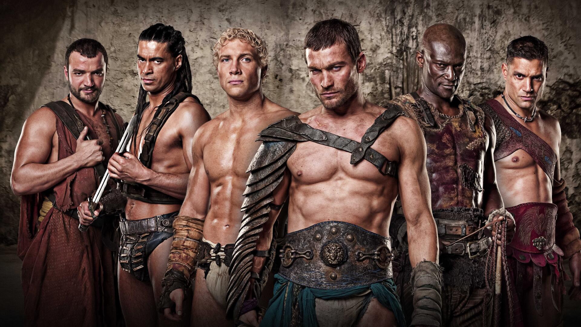 Spartacus: Blood And Sand 4K Ultra HD PC desktop wallpaper — six scarred gladiators in leather armor and weapons posed against a weathered stone wall.