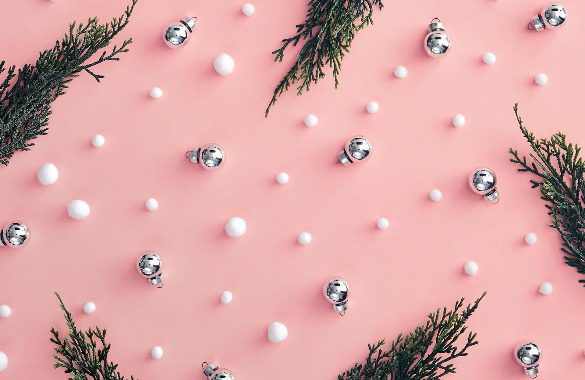 HD PC desktop wallpaper and background: pink girly Christmas scene with scattered silver baubles, tiny white snow dots and evergreen sprigs in a minimalist pink aesthetic.